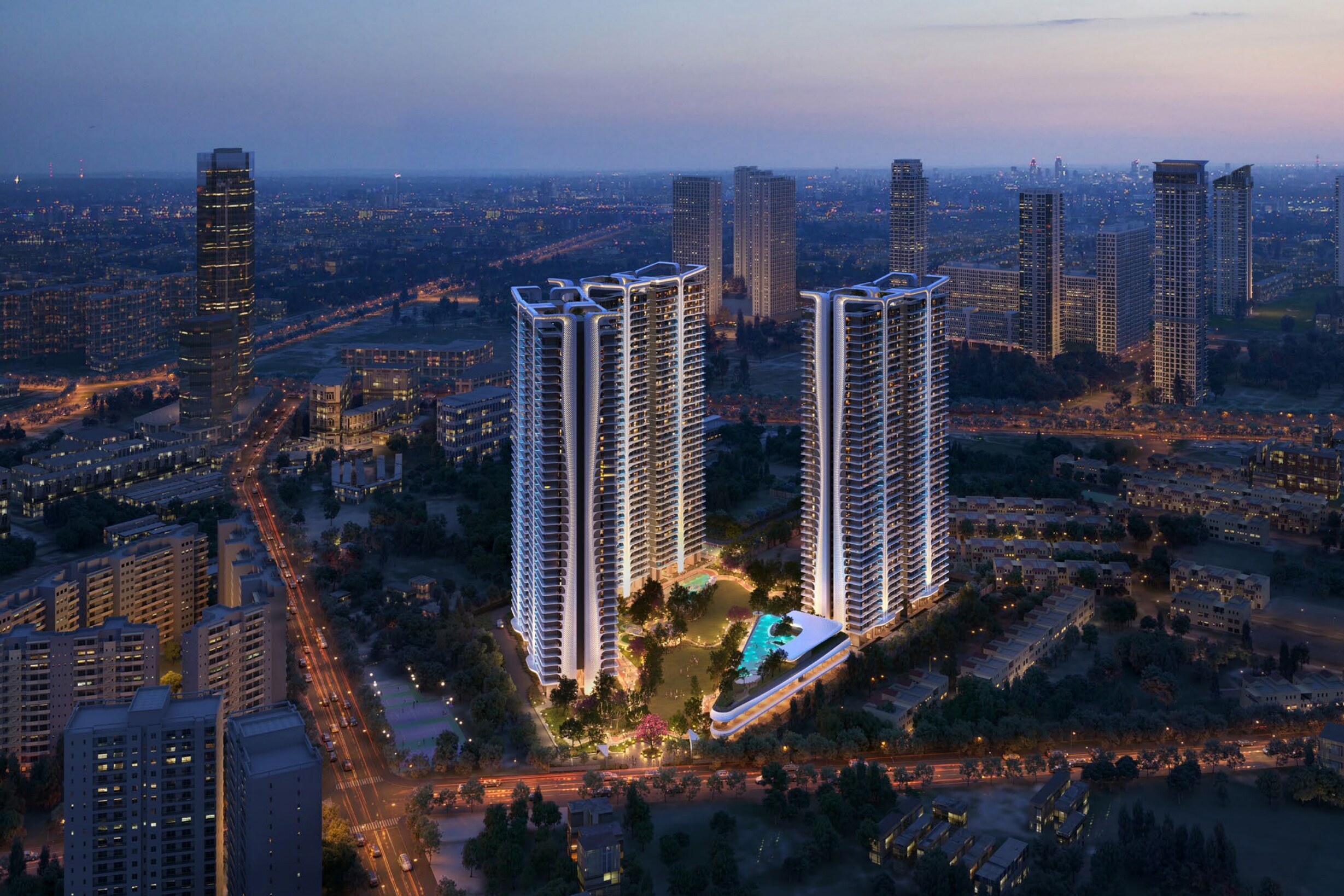 The twin towers at night above the landscaped podium, developer render