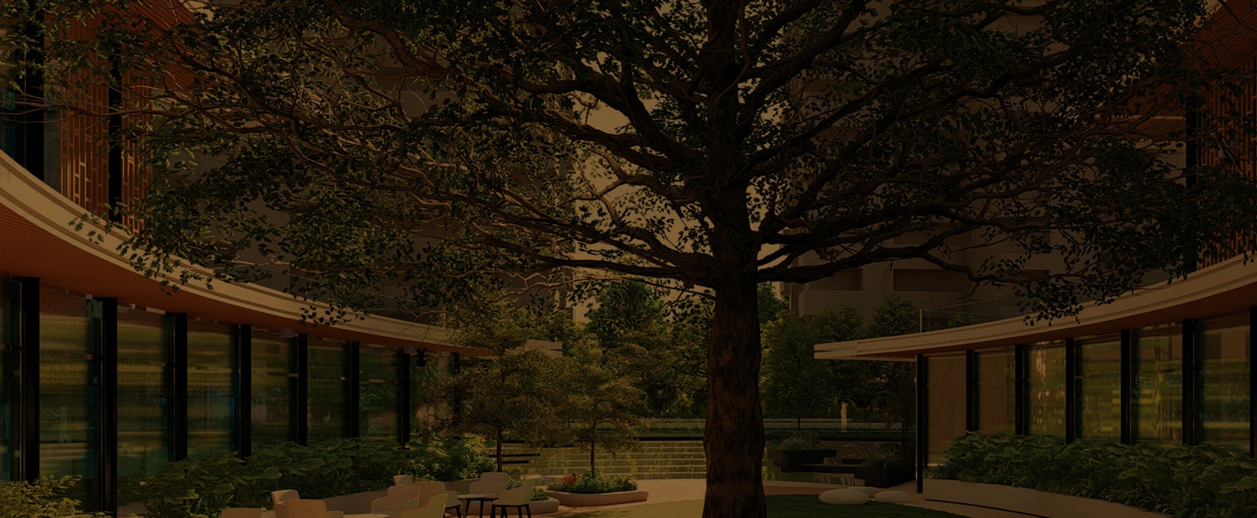 Landscaped central courtyard beneath a heritage tree